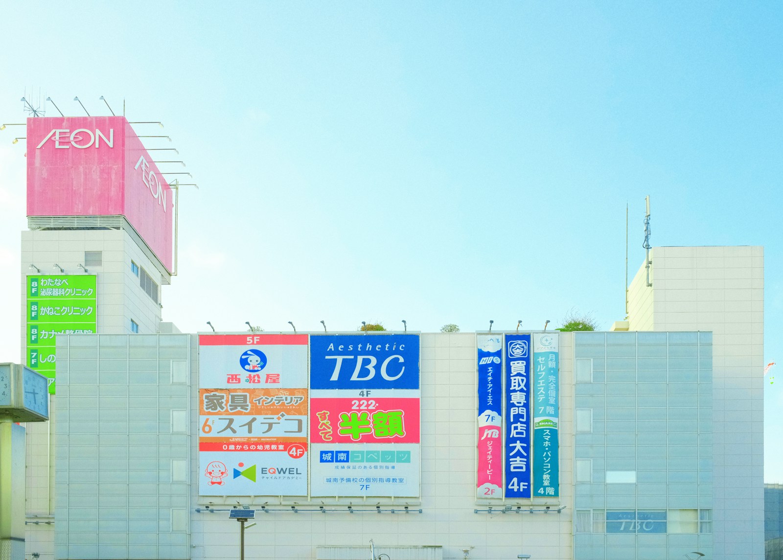 Photo by ZENG YILI a large building with a lot of signs on it